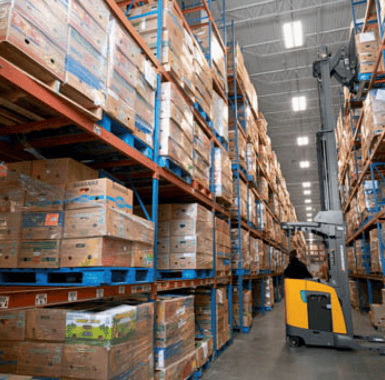 Pantograph reach truck picking pallets in a narrow aisle
