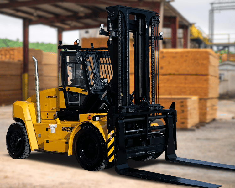 Heavy duty forklift in a lumber yard with lumber stacked up in the background.